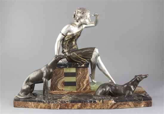 Ugo Cipriani - Uriano (1887-1960). An Art Deco bronzed and silvered spelter group of a lady and two hounds, width 24in. height 17in.